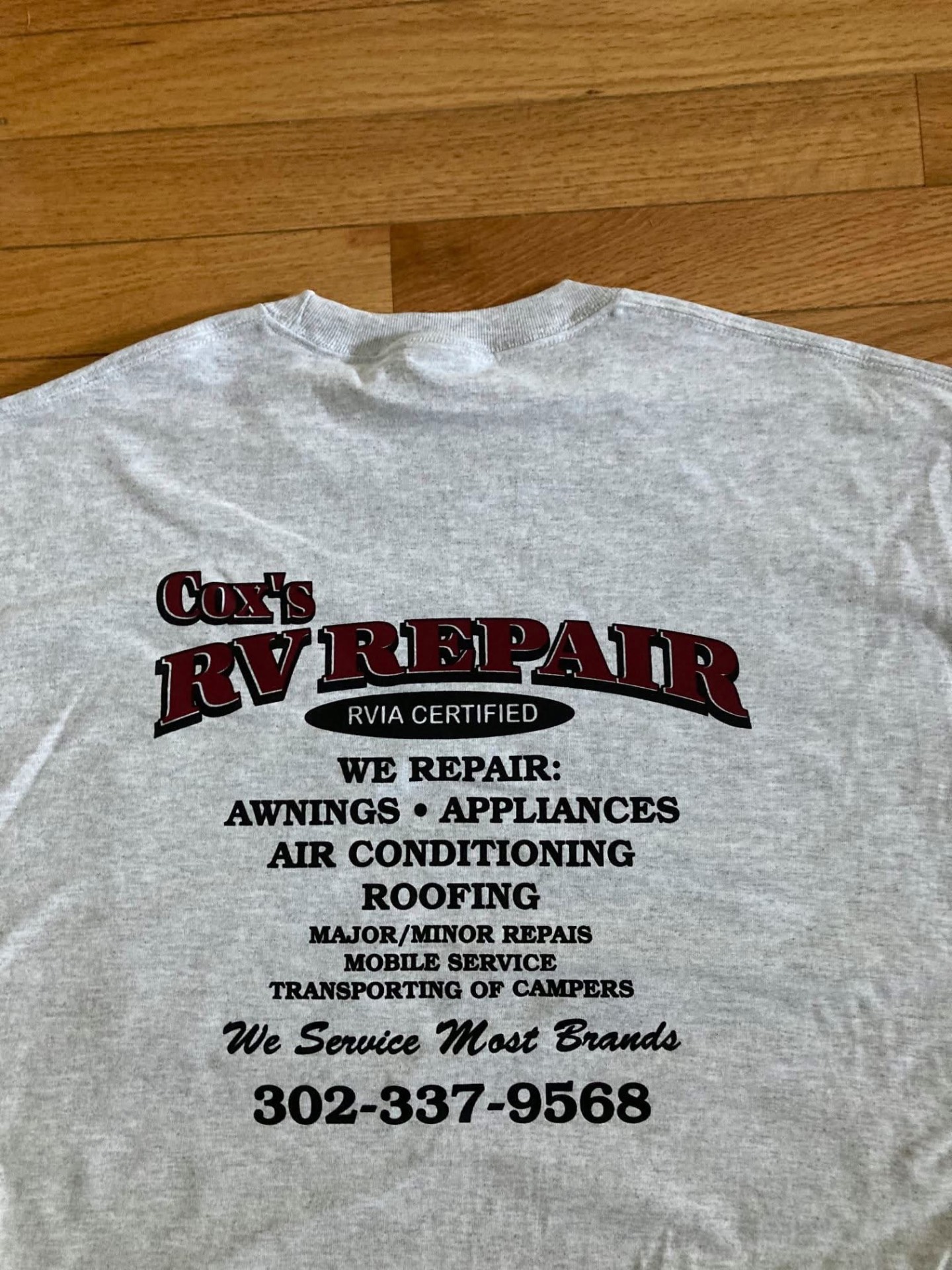 Gray shirt screen printed with the Cox's RV Repair logo and service list